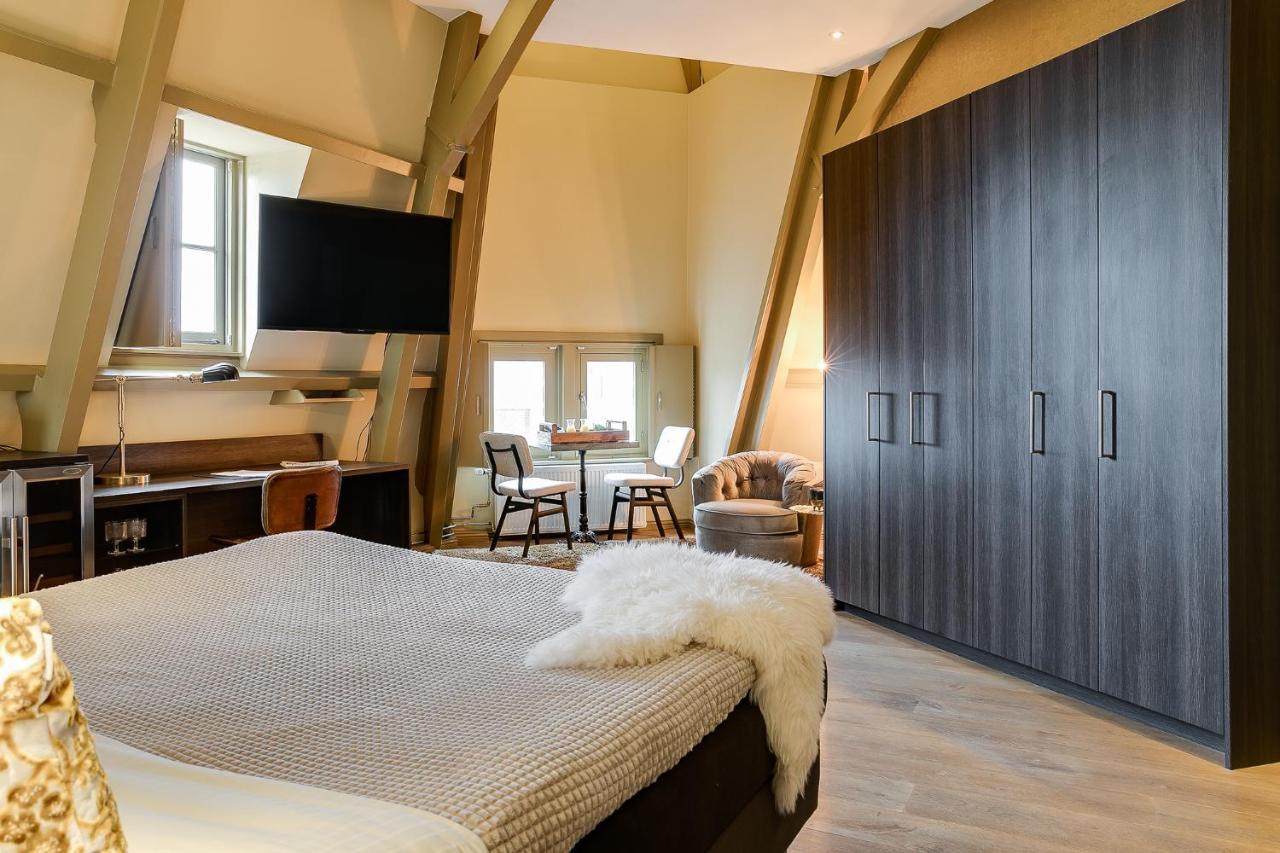 Brasss Hotel Suites Haarlem Exterior photo A bedroom at the hotel