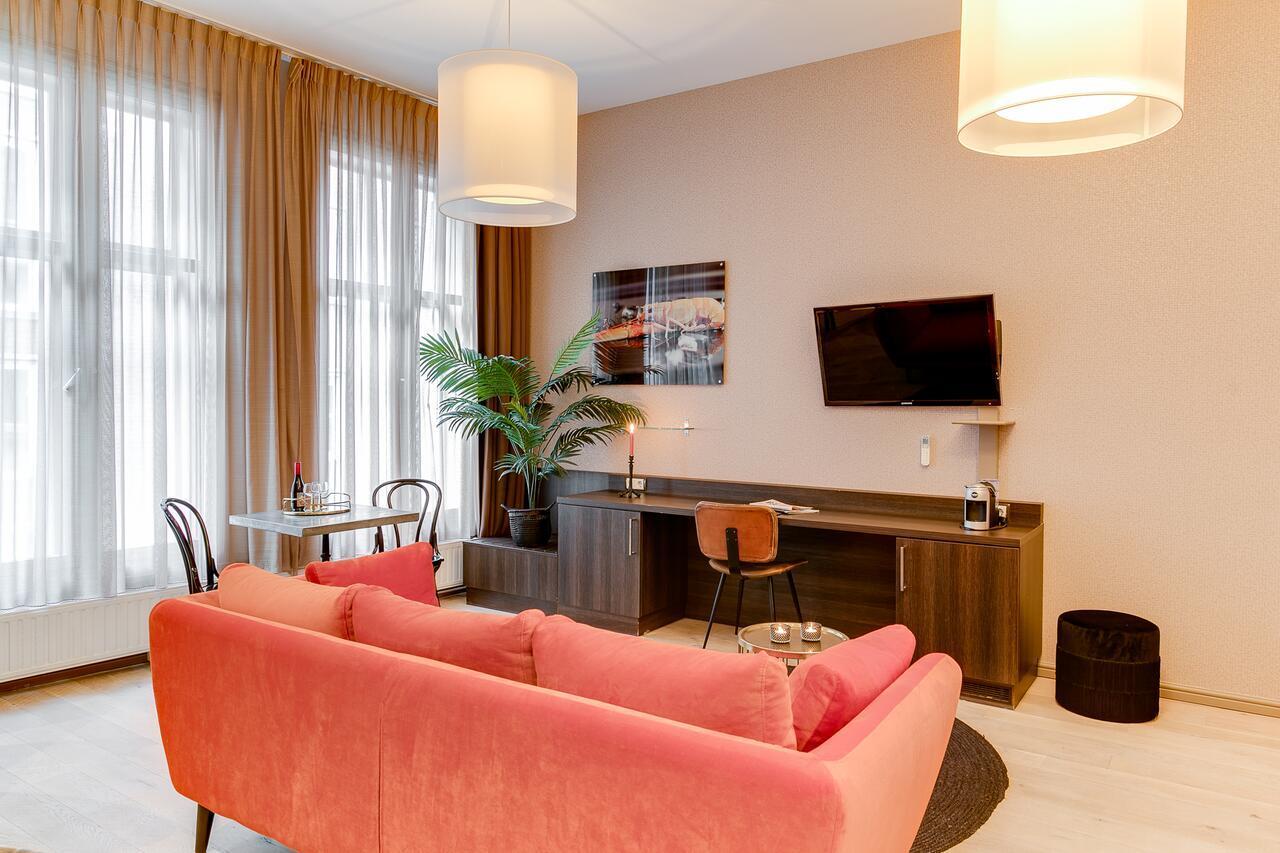 Brasss Hotel Suites Haarlem Exterior photo A living room at the hotel